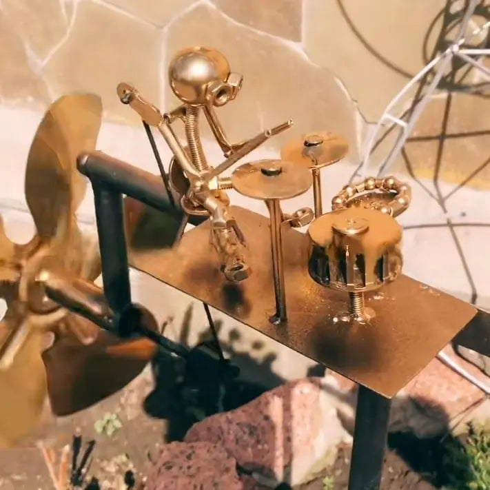Metal wind turbine “Rock Band” – Moving garden decoration with character