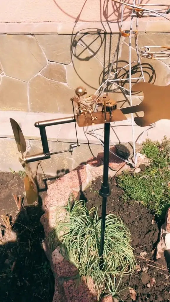 Metal wind turbine “Rock Band” – Moving garden decoration with character